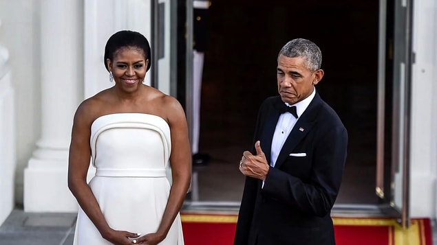 The food gets ready and comes to the table, but one of their servers was nervous enough to actually spill hot tea on the President during his meal.