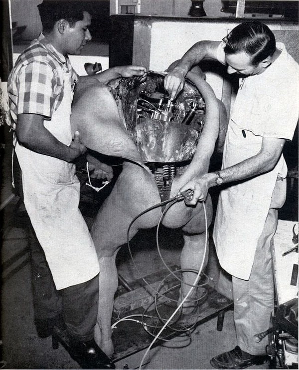 5. Two engineers fix a Disney animatronic.