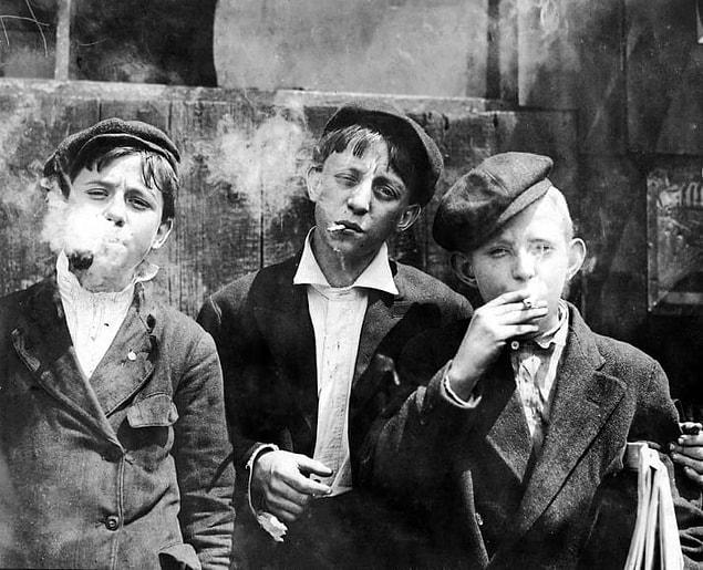1. A group of newsboys have a smoke during their break in St. Louis, May 1910.