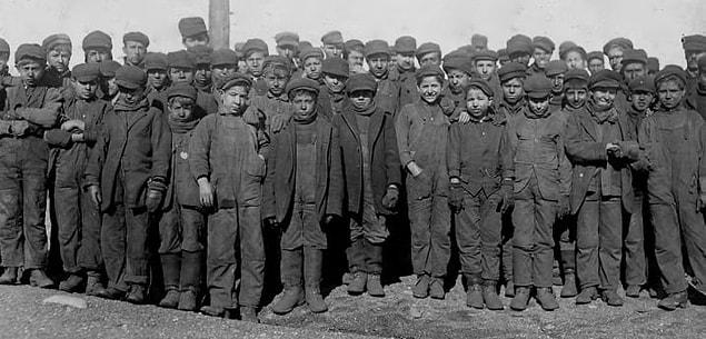 14. Group portrait of child workers employed by the Breaker Pennsylvania Coal Company in Pittston, Pennsylvania, in 1908.