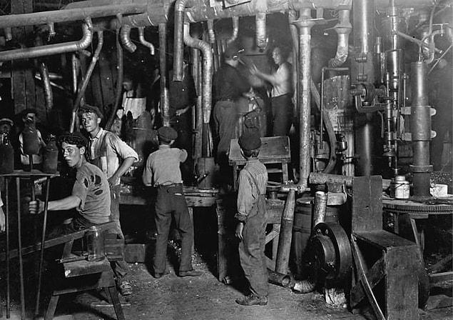 19. Several boys still at work at 9 p.m. during the night shift at the Indiana Glass Works in Indianapolis in 1908.