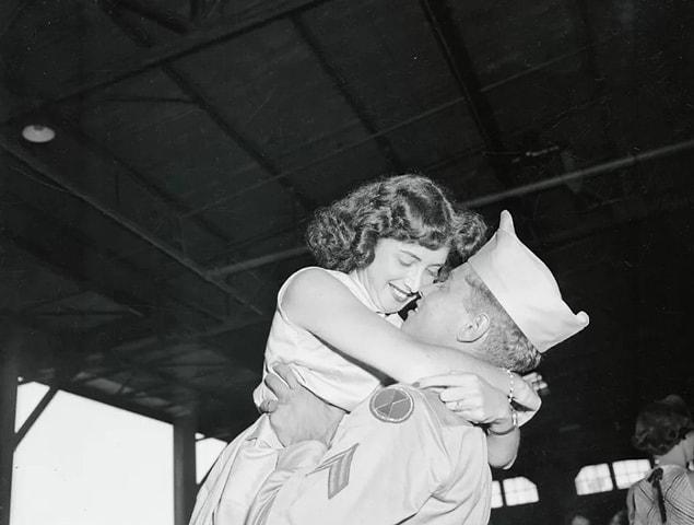 22. Cpl. Howard Ross sweeps his wife Leah off her feet after returning home from war in 1954.