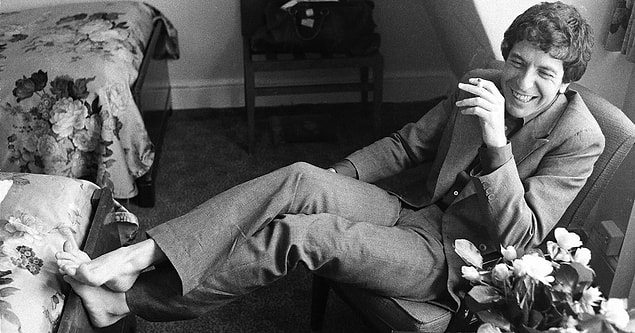 We learn who is singing, but now we're left with the much more perplexing question: "Who is Leonard Cohen?"