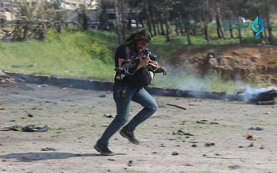 Heroic War Photographer Working To Save A Seriously Injured Child After The Explosion In Syria