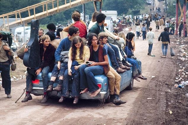 9. A group of hippies catch a ride to Woodstock in 1969.
