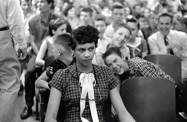 3. Dorothy Counts, the first black women to be placed in a school comprising of only white students in the USA, suffering teasing and humiliation by her white peers. | 1957