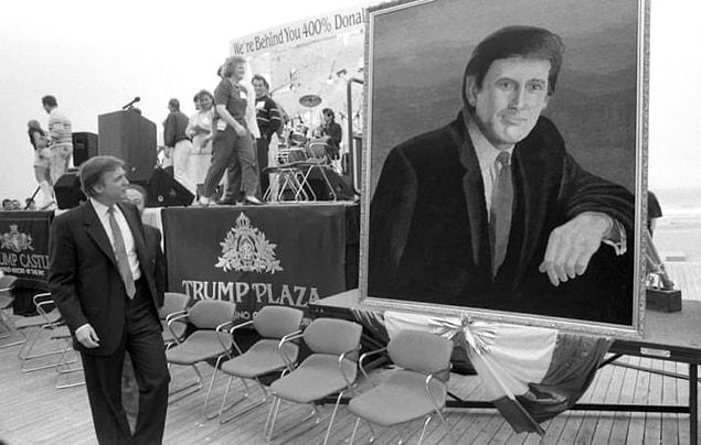 8. Trump admiring a portrait of Trump during his birthday party in 1990.