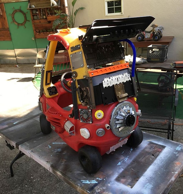 And then he uses every single piece he found at home to decorate the vehicle.