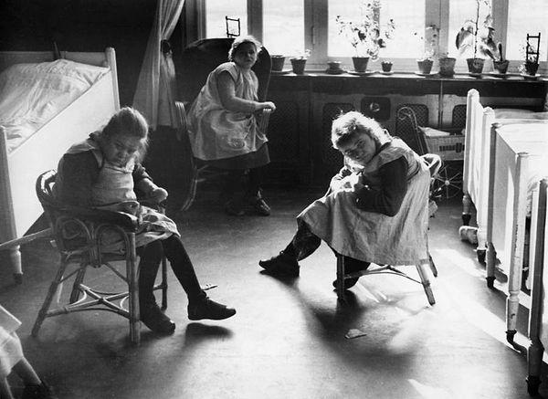 17. Child patients sit in their room at a mental hospital in Ursberg, Germany circa 1934-1936.
