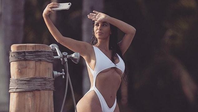 13. White hot! Kim Kardashian flashed some serious underboob in this racy white swimsuit in Mexico.