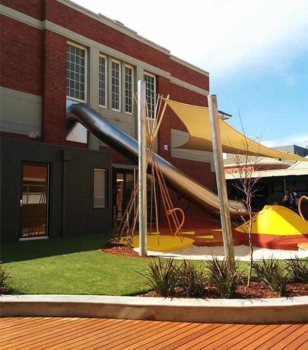 12. This school has a slide direct from classroom to playground. Childhood dream!