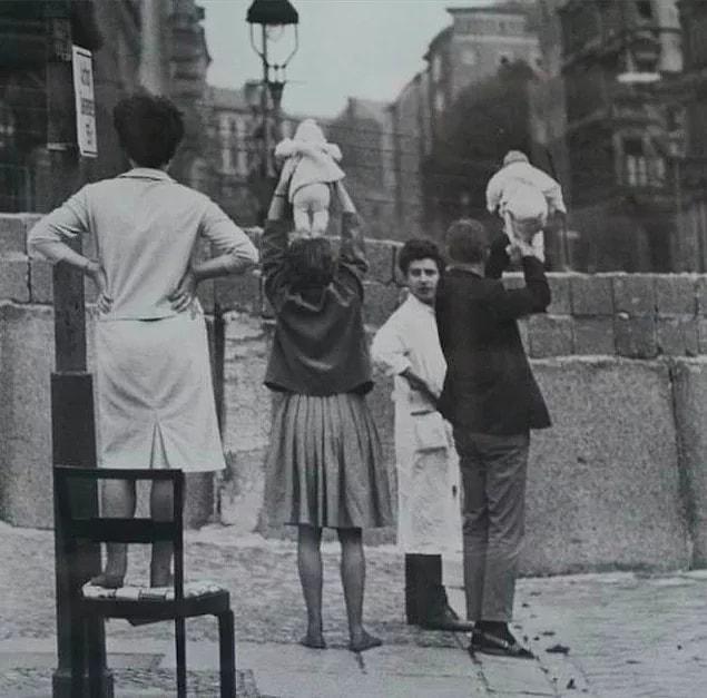 1. Family shows her children to their parents in East Berlin, 1961