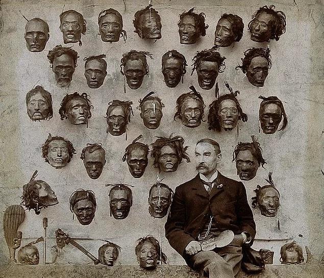 9. Horatio Gordon Robley posing in front of Māori heads collection, 1895