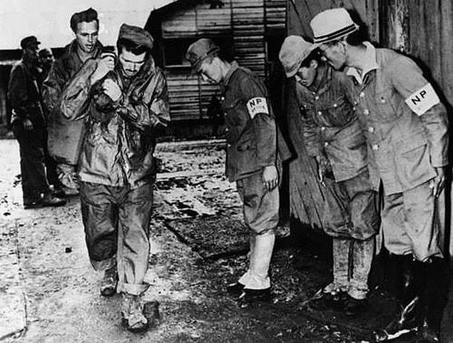 17. Capitulated Japan soldiers bowing to American captives they released, 1945