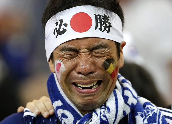 17. Японский болельщик с разбитым сердцем после поражения своей сборной в матче против Бельгии в Ростове-на-Дону 2 июля.