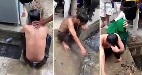 Zina Yapan Çifte Sokak Ortasında Lağım Suyuyla Yıkama Cezası!
