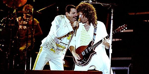 Vokallerde Freddie Mercury'nin eşsiz sesine eşlik etmiş, ayrıca '39, Who Wants To Live Forever, Sail Away Sweet Sister gibi şarkılarda da ana vokalde yer almıştır.