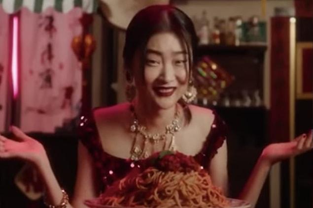 7. Dolce & Gabbana shared an advertisement that shows a Chinese woman struggling to eat pizza and spaghetti using chopsticks.
