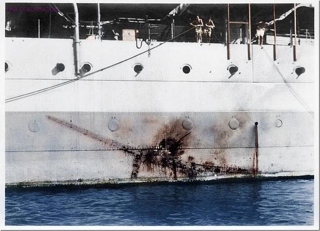 13. The imprint of a kamikaze Mitsubishi Zero along the side of the H.M.S Sussex, 1945