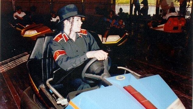 9. Michael Jackson drives bumper cars in 1994.
