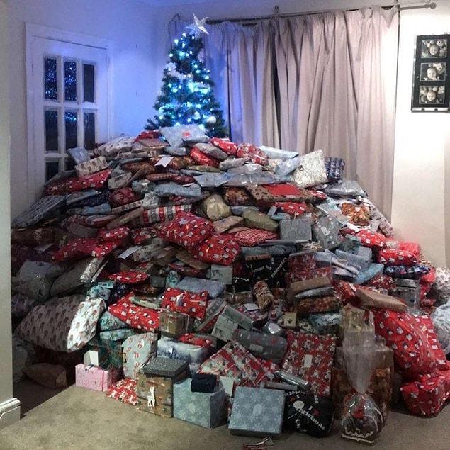 38-year-old Emma Tapping shared a photo of her Christmas tree hidden by huge mound of presents.