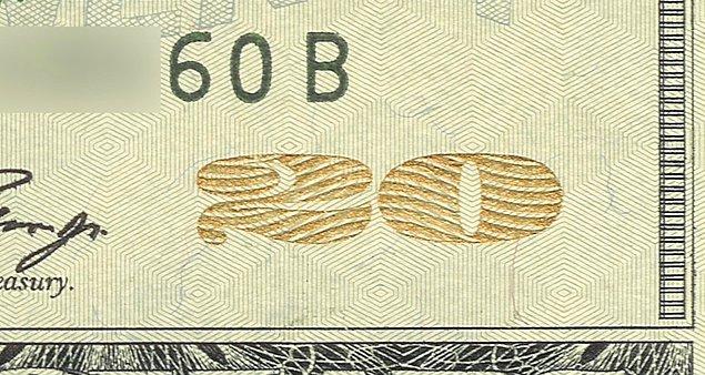 Paranın sağ alt köşesinde yer alan 20 figürü bakılan açıya göre renk değiştiren özel bir mürekkeple oluşturulmuş.