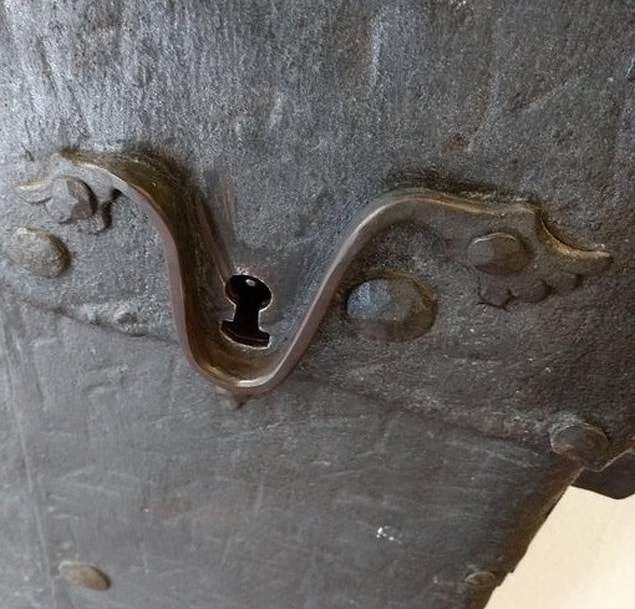 16. In Germany, this antique door helps you find the keyhole, even in the dark.