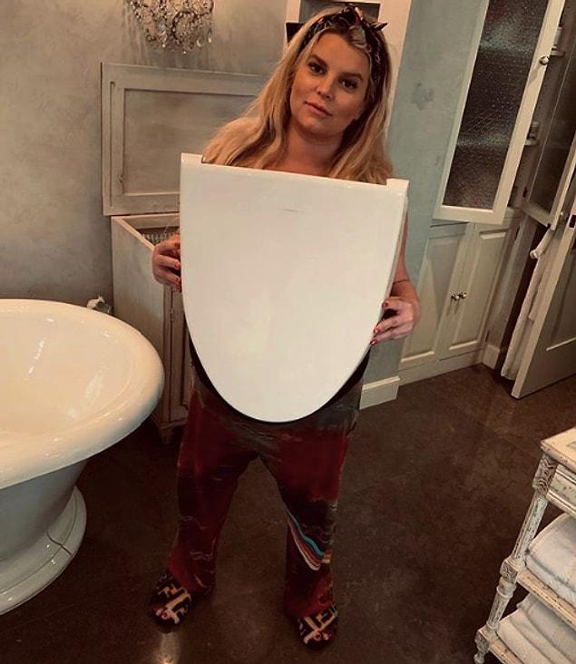But not finished yet! She also shared a photo of herself holding a toilet seat.