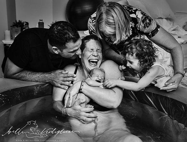1. This powerful photo won the First Place: "Our Rainbow Baby Is Finally Here" by Belle Verdiglione