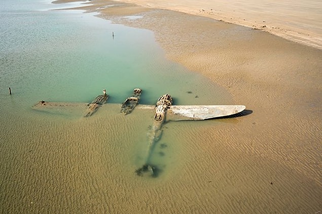 7. "65 years after it crash-landed on a beach in Wales, an American P-38 Lightning emerged from under the sand."