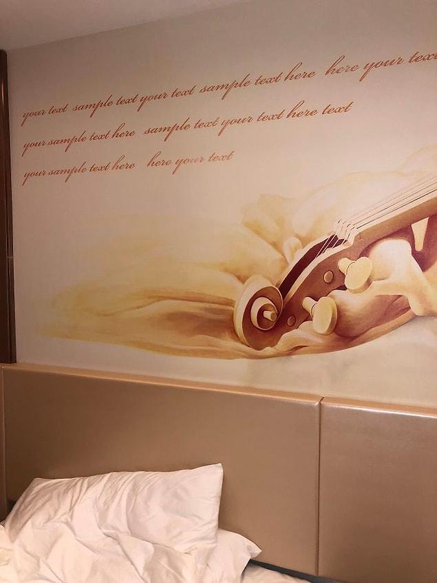 8. "This hotel forgot to insert a quote into the wall decorations text sample."