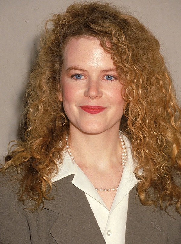 15. Такой мы запомнили Николь Кидман: с рыжей копной мелких кудряшек. Это было в конце 80-х.