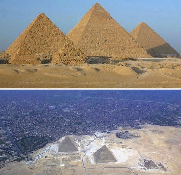 17. Uçsuz bucaksız bir çölün ortasında heybetli görünen piramitler, öte yanda neredeyse şehrin içinde oldukları farklı bir açından çekilmiş fotoğraf.