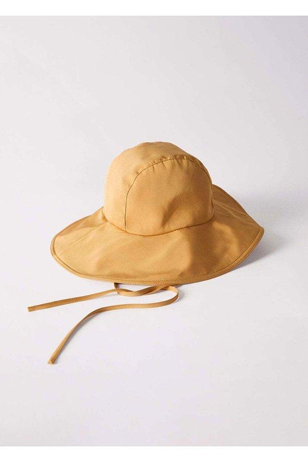 14. Yazın plajlarda yüzünüzü koruyup, başınıza güneş geçmesini önleyecek şık bir şapka.