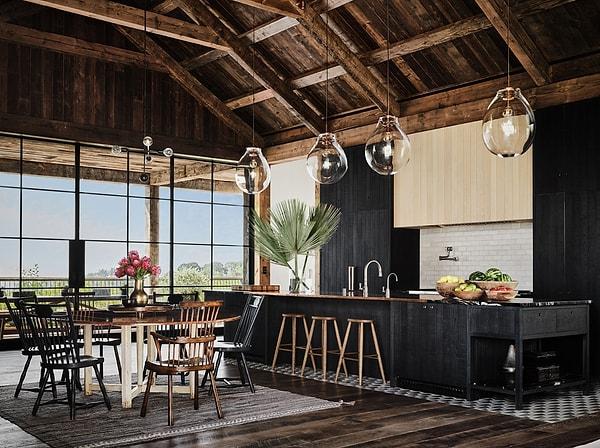 Yüksek tavanlar açık bir mutfak ve küçük bir yemek masasıyla birleşince havadar ve sıcak bir atmosfer yaratıyor.