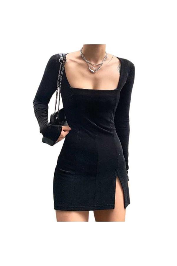 14. Siyah yırtmaçlı elbisenin parlak kadifemsi esnek bir kumaşı var...