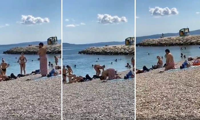 Plajda İnsanların İçinde, Beline Plaj Havlusu Sarılı Bir Şekilde Namaz Kılan Adam