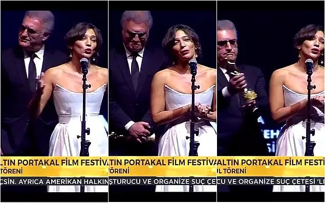 Çareyi Yalçın'ın konuşması sırasında bir anda ödülü eline vermede buldu ancak bu hareketi ters tepti...