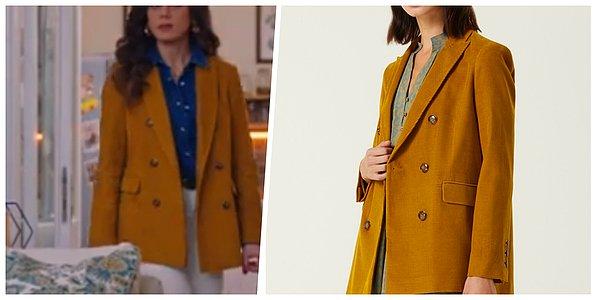 3. Azra'nın sarı ceketi Network markasının tasarımı.