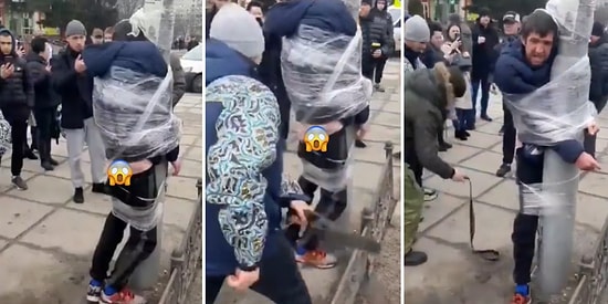 Ukrayna'da Vatandaşlar, Yakaladıkları Yağmacıyı Direğe Sarıp Poposunu Kırbaçladılar