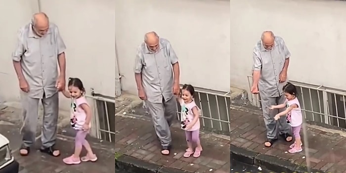 Dedesi ile Birlikte Yağan Yağmurun Tadını Çıkartan Küçük Kızı İzlerken Gözlerinizden Kalpler Fışkıracak