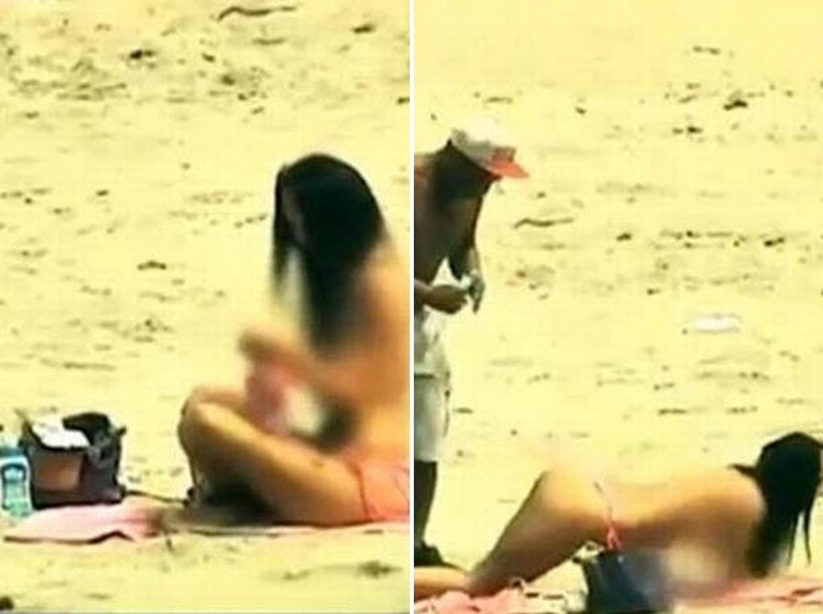 Plajda üstsüz güneşlenen kadınlar