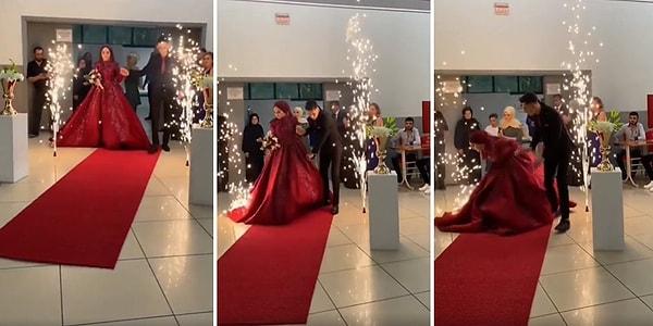 Salonun girişinin iki yanına yerleştirilen düğün volkanı havaya ateş püskürtürken bir anda gelinin elbisesinin altına giriyor.