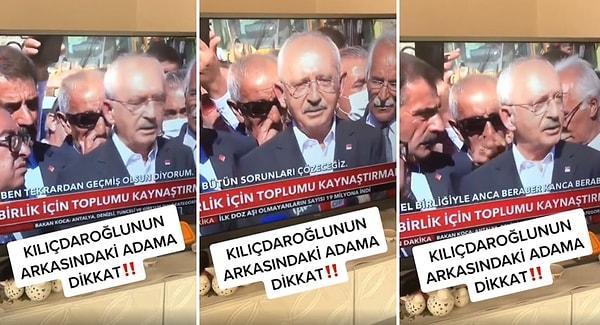 Kemal Kılıçdaroğlu'nun canlı yayında mikrofonlara konuştuğu bir anda, arkasındaki dayı burnunu karıştırırken görülüyor. O dayı burnunu bir güzel karıştırdıktan sonra çıkanları ise Kılıçdaroğlu'nun arkasına siliyor.