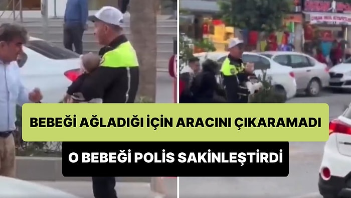 Bebeği Ağladığı İçin Aracını Park Alanından Çıkaramayan Kadının Bebeğini Alıp Sakinleştiren Polis Memuru