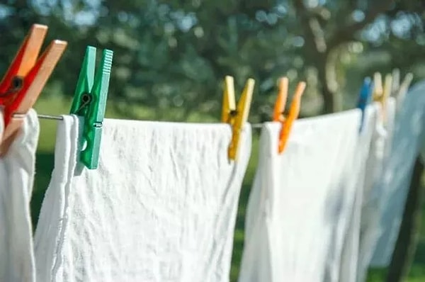 After washing your white clothes, let them dry outdoors.