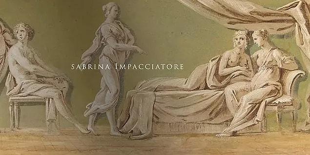 21. Sabrina Impacciatore's name comes up when we see a woman who is interested in two women stretched out on a bed.