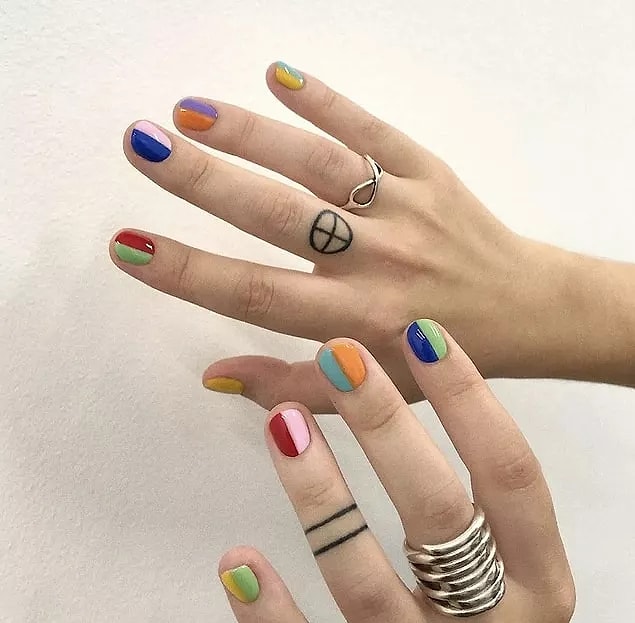 24. Can't decide? You can try to get the most out of them all by matching pastel and bright colors to each nail.