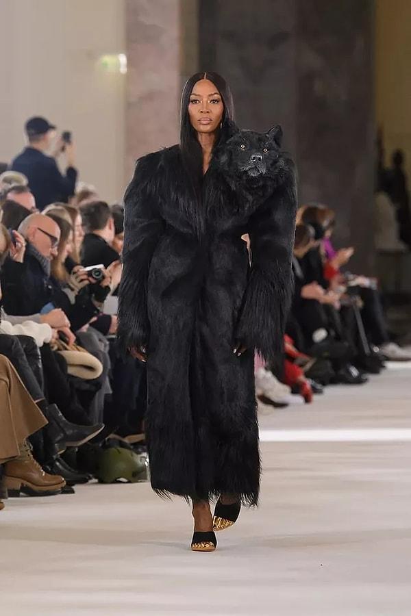 Finally, let's look at the designs that made their mark on the show. Naomi Campbell came out on stage carrying a fake fur coat that resembles the taxidermy technique on it!