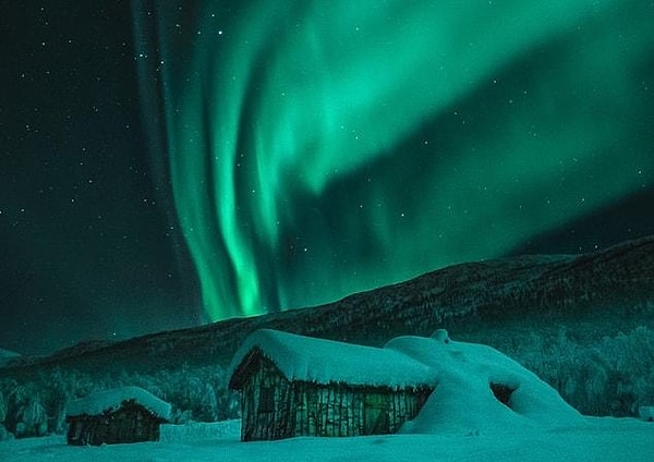 When an electric charge crosses a magnetic field, it produces an electric current. As these currents descend into the atmosphere along the magnetic field lines, they gather more energy.